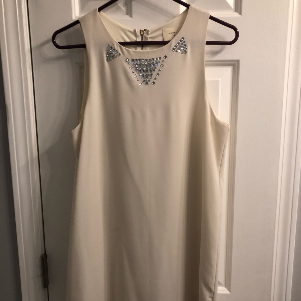 White dress with embellishments. Never worn